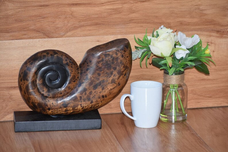 Hand carved wooden shell on stand